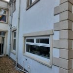 Rendering the back and sides of a semi-detached house in Tredegar