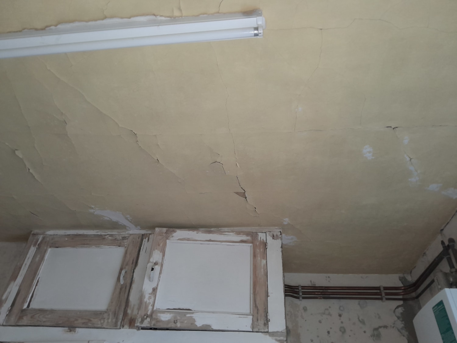 Replacing a kitchen ceiling with new plasterboard in Brighton
