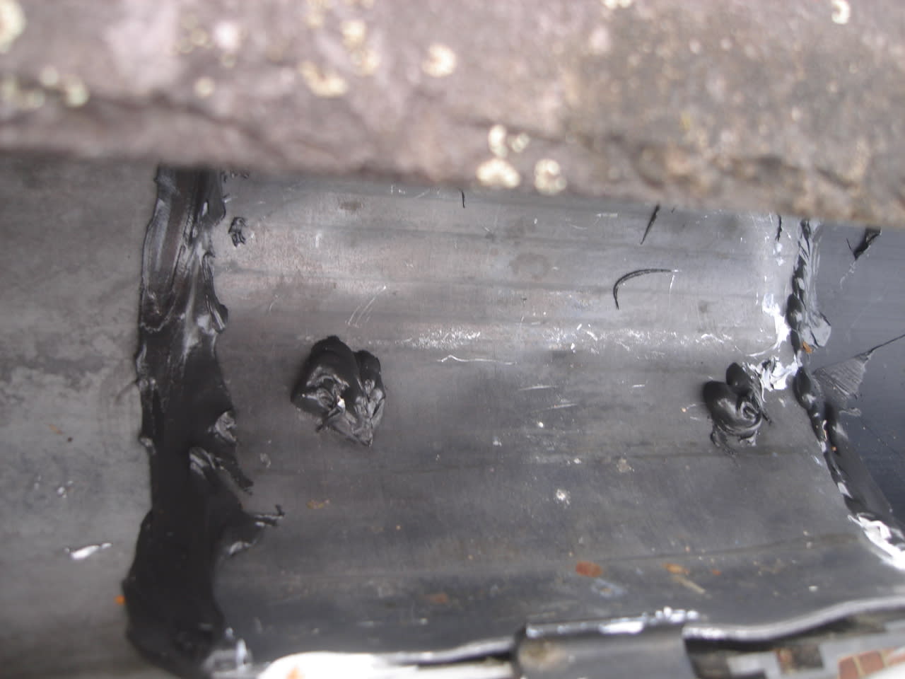 Replacement of leaking gutter joint in Northampton terrace home