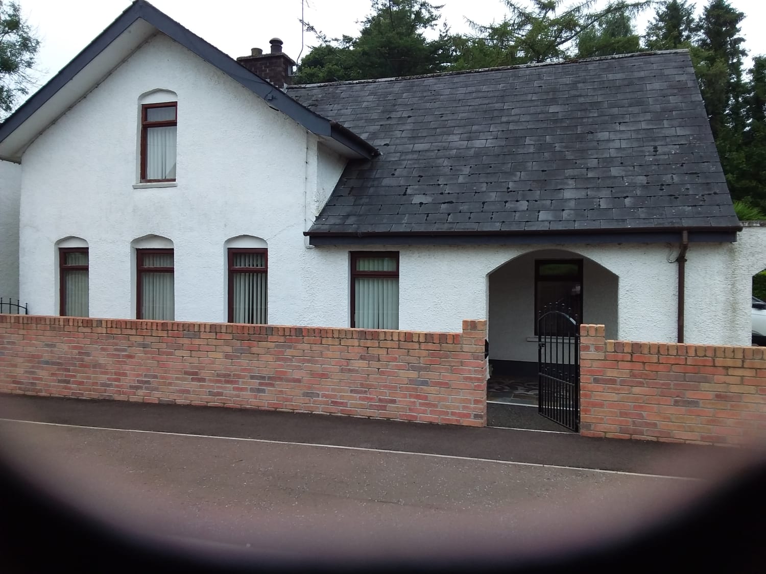 Refreshing white exterior paint for a detached bungalow-style house in Antrim