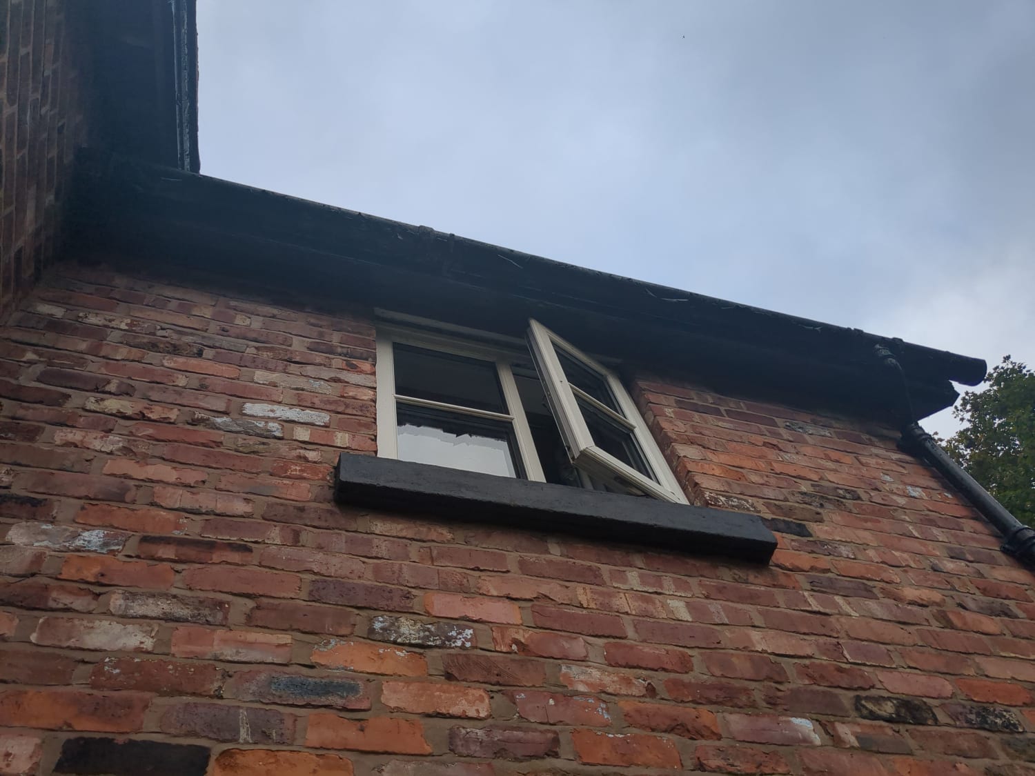Replacing a cast iron bracket and cleaning gutters in Northwich