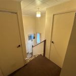 Removing asbestos textured coating from stairs wall in Sheffield