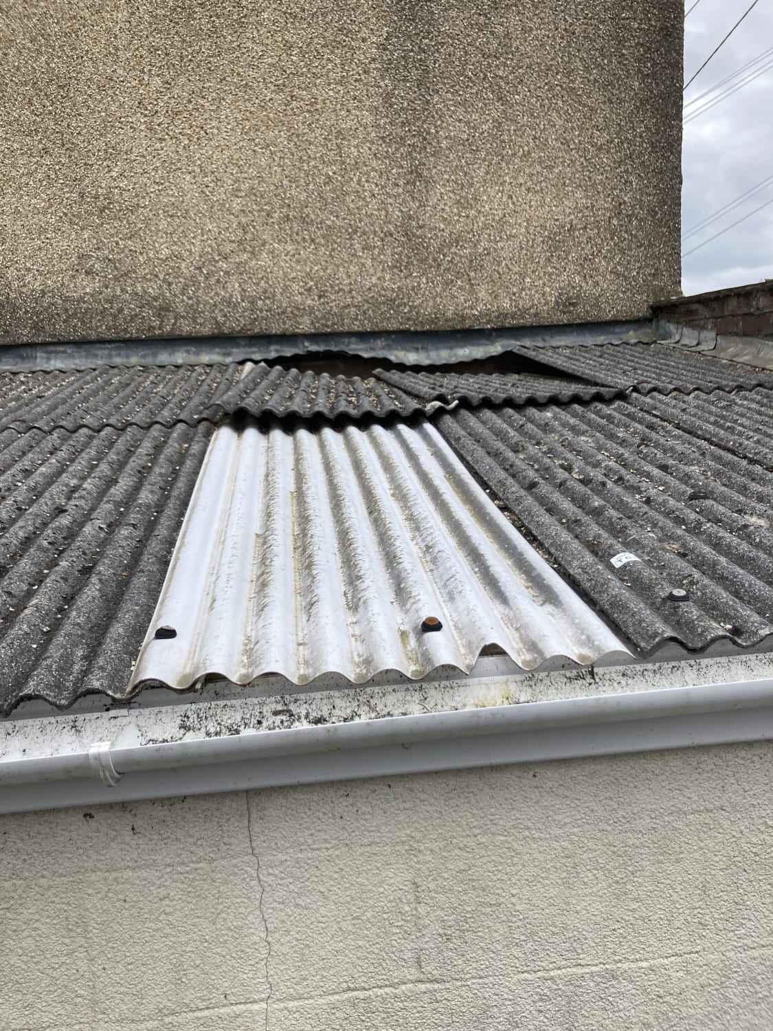 Safe removal of chrysotile asbestos sheets from a terrace garage in Llanelli