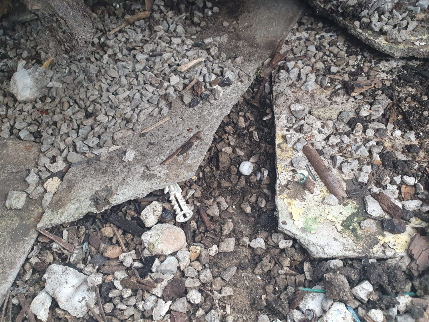 Safe removal of hard asbestos slabs under decking in London Charlton