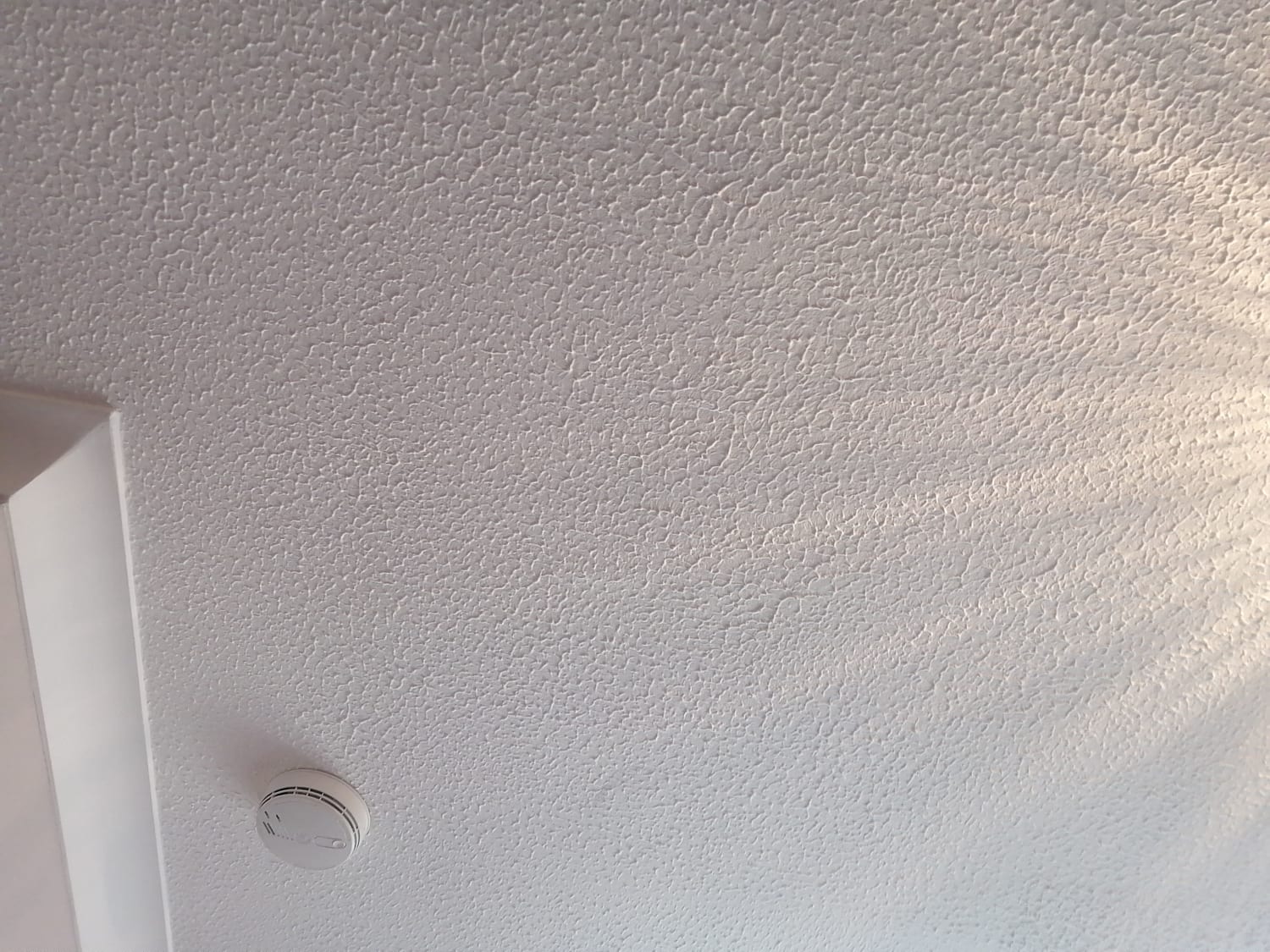 Safe removal of asbestos textured coating from a living room in Bath