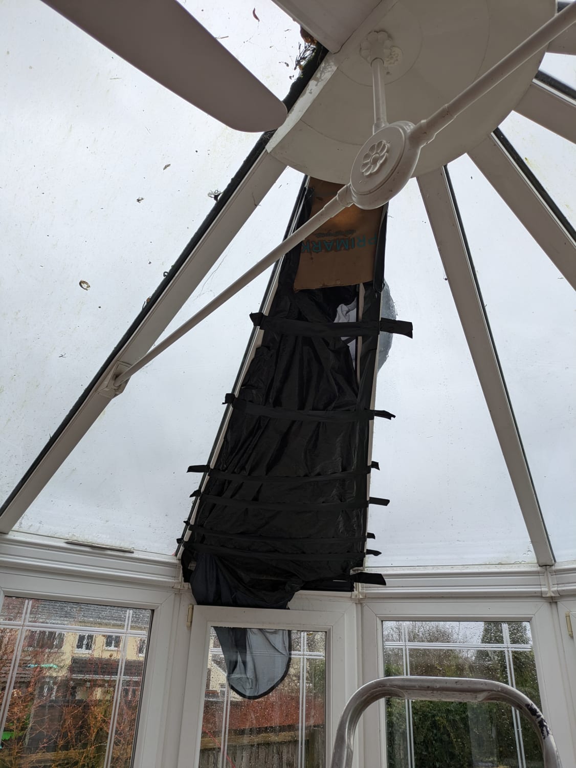 Replacement of a smashed triangular conservatory glass roof pane in Bridgend