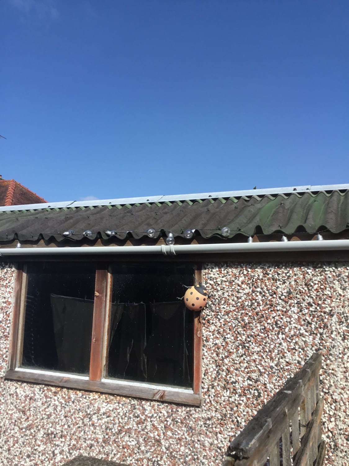 Corrugated sloping garage roof replacement in Deeside