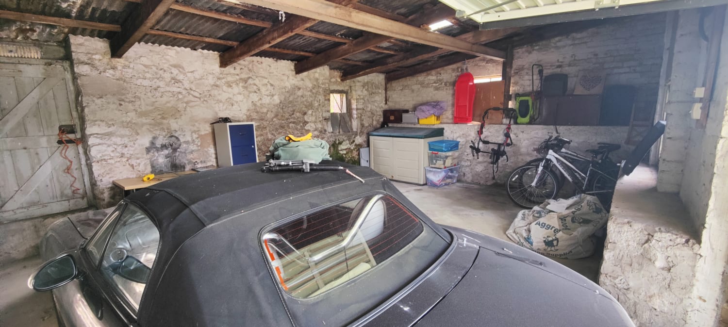 Cost-effective repair or replacement of a double garage roof in Kelso