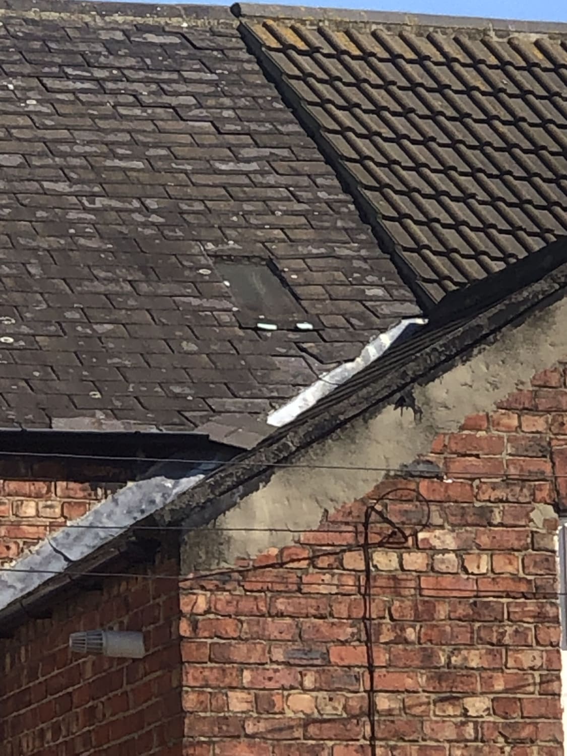 Slate replacement and gutter debris removal in Redcar