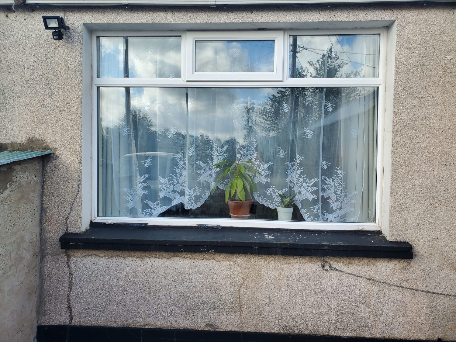 Resealing and cleaning a double-glazed window panel in Ballymoney