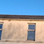 Ridge tile replacement on two-storey return in Bangor