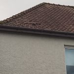 Reinstating and repositioning roof tiles on a semi detached house in Glasgow